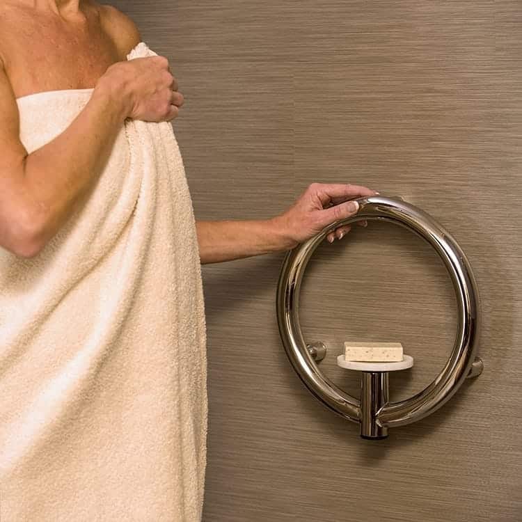 Woman holding the Invisia Soap Dish for support