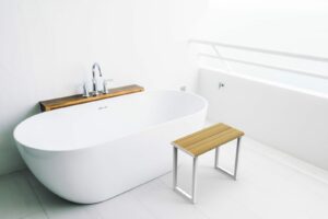 White bathtub with wood decor