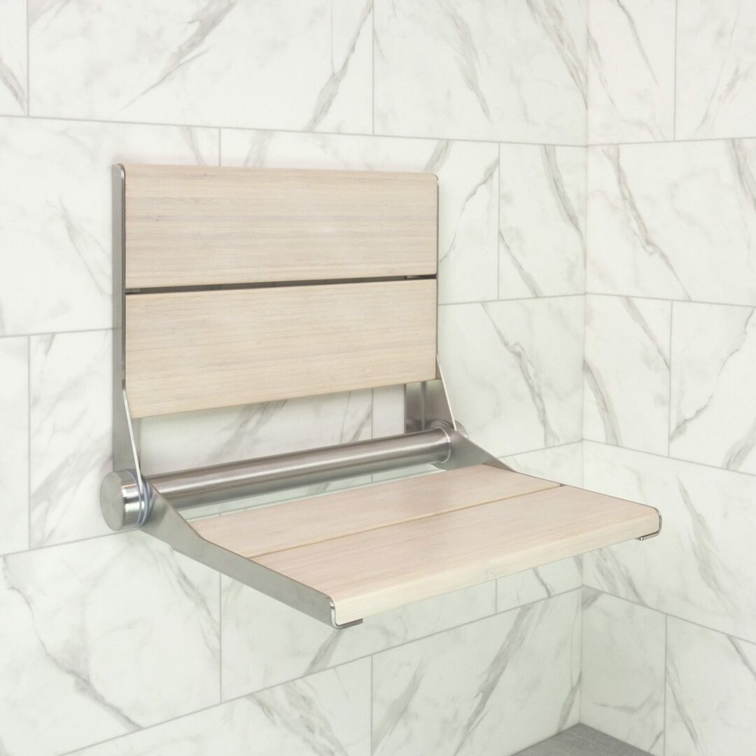 The SerenaSeat Pro installed in a shower - Seat is Brushed Stainless frame and Light Bamboo wood finish