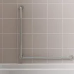 L-shaped grab bar on a tile wall in a bath/shower combo.